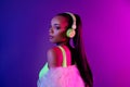 Photo of dreamy seductive lady dressed fur coat headphones enjoy music isolated violet color background Royalty Free Stock Photo