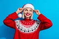 Photo of dreamy sweet woman lady santa elf wear ornament pullover looking empty space isolated blue color background Royalty Free Stock Photo