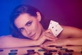 Photo of dreamy tempting lady naked shoulders playing casino blue pink color background