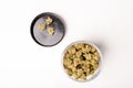 Jar full of Dry marijuana buds, cannabis dried flowers, medical marijuana, laying on the white table