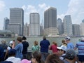 East River Cruise Passengers and Tall Buildings in New York City