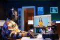 Photo editor using editing software in a digital workspace at home