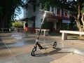 Photo editorial, indonesia, manual kick scooter at public park, no people seen