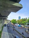 Photo editorial, 17 january 2023, top view big building, skycrapper, car, motorcycle and people on the road, indonesia