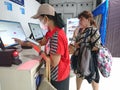 Photo editorial, 07 november, 2 woman doing ticket printing at yogyakarta yogya, jogja, jogjakarta, indonesia train station