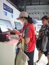 Photo editorial, 07 november, 2 woman doing ticket printing at yogyakarta yogya, jogja, jogjakarta, indonesia train station