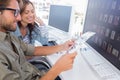 Photo editors happily viewing the contact sheet