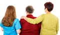 Elderly woman and young caregivers Royalty Free Stock Photo