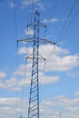 Photo of an electric tower against a blue sky. high voltage post. High voltage tower against the blue sky. Power line Royalty Free Stock Photo
