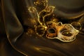 Photo of elegant and delicate golg Venetian mask over dark silk background