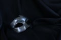 Photo of elegant and delicate Venetian mask over black silk background Royalty Free Stock Photo