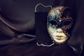 Photo of elegant and delicate Venetian mask over black silk background. Coronavirus prevention concept Royalty Free Stock Photo