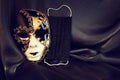 Photo of elegant and delicate Venetian mask over black silk background. Coronavirus prevention concept Royalty Free Stock Photo