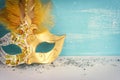 Photo of elegant and delicate Venetian mask over white and blue background. Carnival masquarede and christmas concept Royalty Free Stock Photo