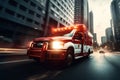 Photo of an emergency ambulance car moving fast on night american city downtown district with motion blur. Royalty Free Stock Photo