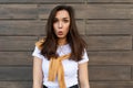 Photo of emotional positive happy joyful pretty young brunette woman in trendy outfit. Beautiful attractive female
