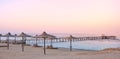 Photo of an empty beach at a purple sunset Royalty Free Stock Photo