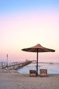Photo of an empty beach at a purple sunset Royalty Free Stock Photo
