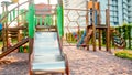 Image of empty big wooden playground at park with lots old ladders, stairs and slides