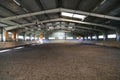 Photo of an empty indoor riding hall for horses and riders Royalty Free Stock Photo