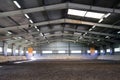 Photo of an empty indoor riding hall for horses and riders Royalty Free Stock Photo