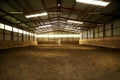 Photo of an empty indoor riding hall for horses and riders Royalty Free Stock Photo