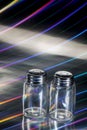 Empty Salt and Pepper Bottles on Rainbow Royalty Free Stock Photo