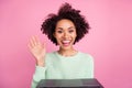 Photo of excited attractive dark skin lady arm palm wave speak communicate isolated on pink color background Royalty Free Stock Photo