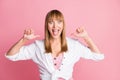 Photo of excited crazy lady open mouth direct thumbs herself wear white blouse isolated pink color background Royalty Free Stock Photo