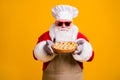 Photo of excited dreamy santa chef headwear grandpa grey white beard hold fresh sweet pie jam yummy flavor wear x-mas Royalty Free Stock Photo