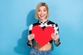 Photo of excited funky lady wear dalmatian print clothes rising big red heart isolated blue color background