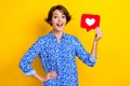 Photo of excited funky lady wear print shirt rising heart feedback postcard open mouth isolated yellow color background