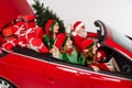 Photo of excited funky people santa team ride car have fun wear costume  white color background Royalty Free Stock Photo