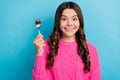 Photo of excited hungry girl dressed knit pullover holding spoon isolated blue color background