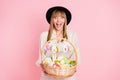 Photo of excited lady hold easter basket open mouth wear vintage headwear dotted dress isolated pink color background