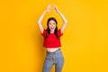 Photo of excited positive girl look fingers make heart love symbol isolated over bright shine color background