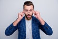 Photo of excited smart man looking at you wearing specs observing his eye sight normalizing after buying new eye glasses Royalty Free Stock Photo