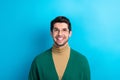 Photo of excited thoughtful man wear green cardigan spectacles looking up empty space isolated blue color background Royalty Free Stock Photo