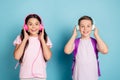 Photo excited two small kids classmates boy girl have lesson break pause listen headset modern music songs amazed volume Royalty Free Stock Photo