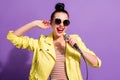 Photo of excited youth girl sing song mic karaoke over purple color background