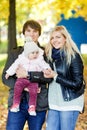 Photo of family with daughter in autumn park Royalty Free Stock Photo