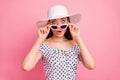 Photo of feared worried cute girl seeing airplane wing falling off while with pink background