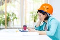 Photo of female engineer wearing orange helmet. Royalty Free Stock Photo