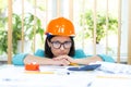 Photo of female engineer wearing orange helmet. Royalty Free Stock Photo