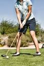 Portrait of female Golfer Teeing Off Royalty Free Stock Photo