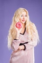 Photo of female holds sweet delicious doughnut