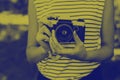 Photo film camera in the hands of the girl. Royalty Free Stock Photo