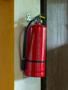Fire extinguisher in a restaurant wall Royalty Free Stock Photo