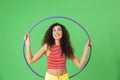 Photo of fitness woman 20s wearing summer clothes doing exercises with hula hoop during gymnastics Royalty Free Stock Photo