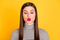 Photo of flirty dreamy happy woman send air kiss closed eyes red pomade isolated on yellow color background